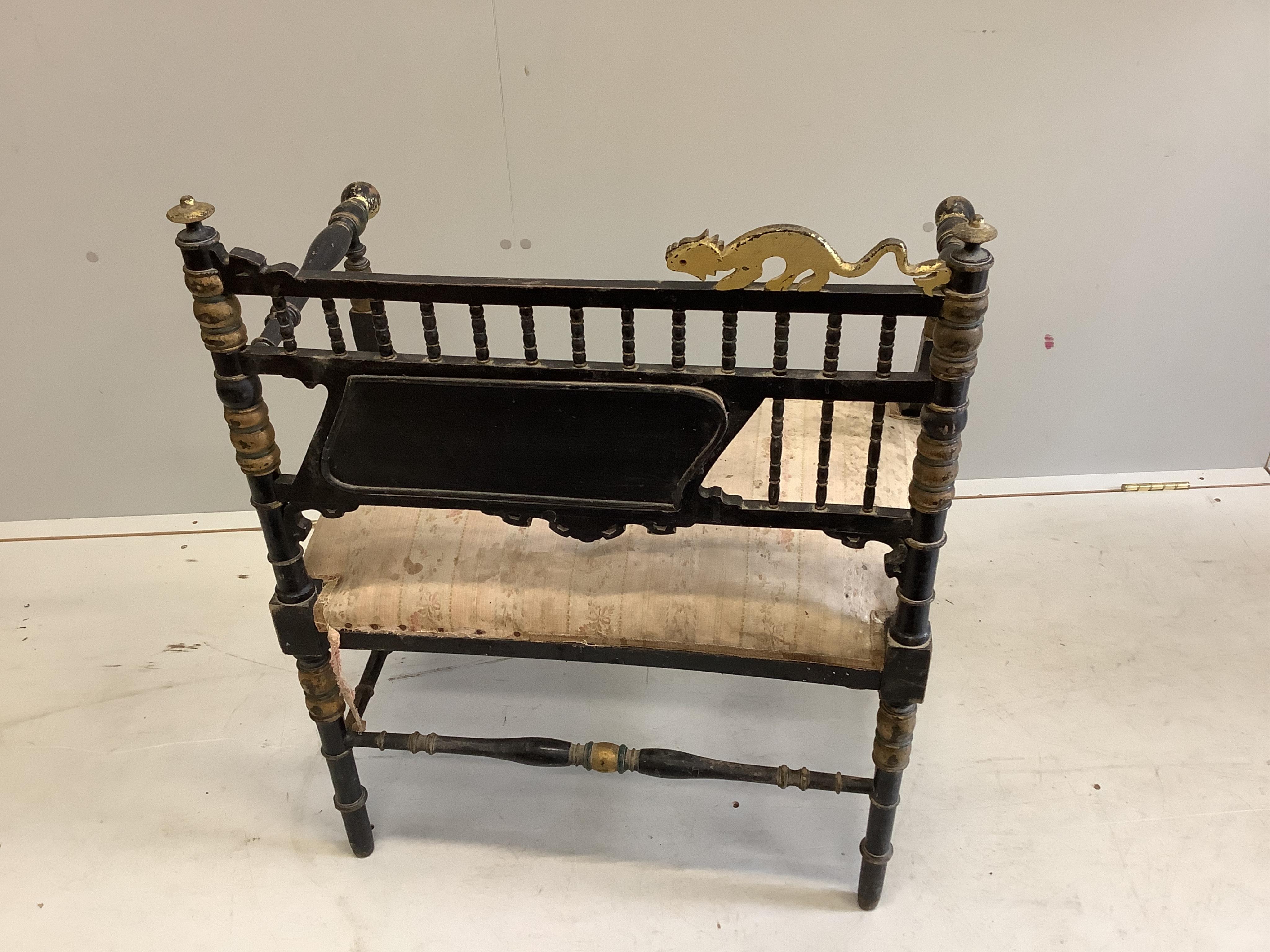 A Napoleon III Aesthetic movement ebonised salon chair, with gilt decoration and carved with the figure of a stylised beast on the cresting rail, width 67cm, height 81cm. Condition - poor to fair